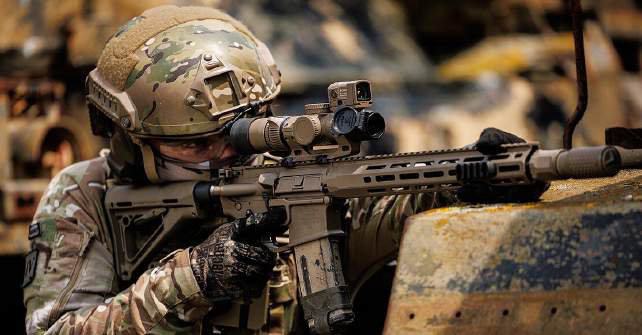 Soldier aiming an assault rifle